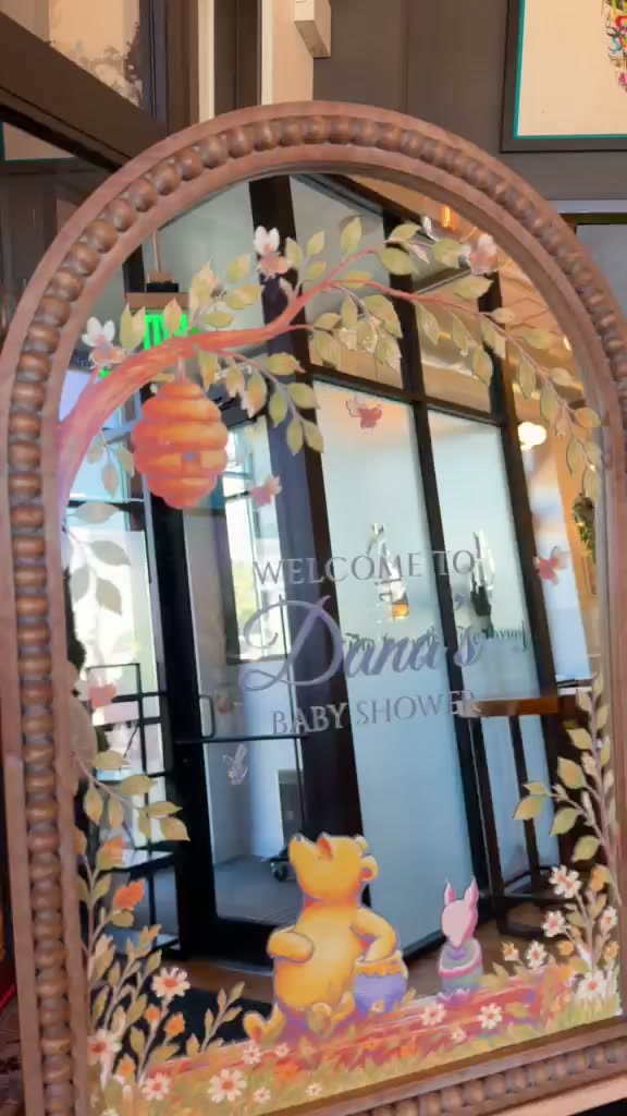 Arched mirror welcome sign with full-color vinyl artwork for a baby shower